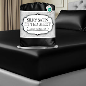 DECOLURE satin king sheet in black photographed flat to show smooth silk-like surface for luxurious sleep