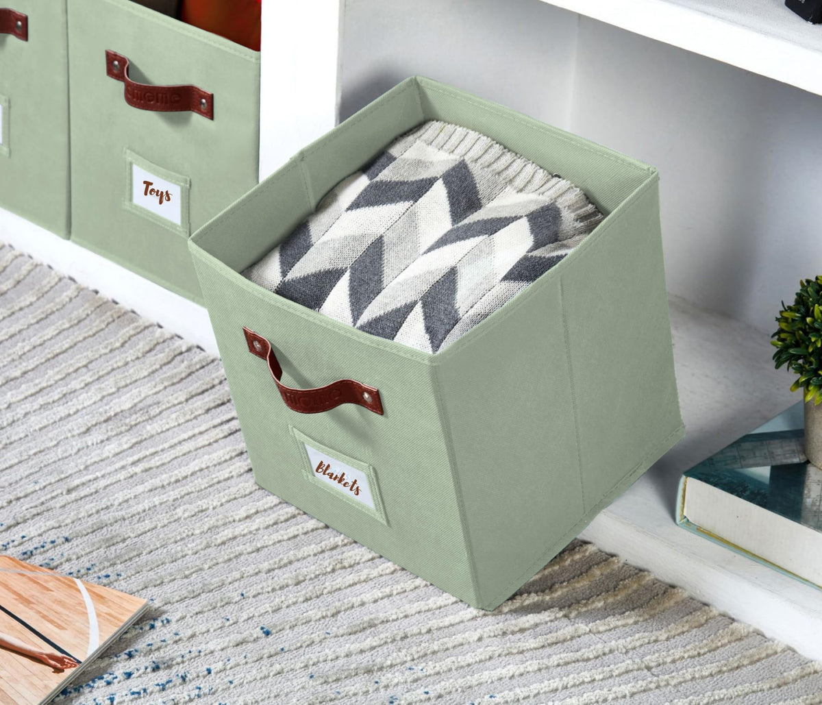 DECOMOMO sage green storage bin stacked neatly in a cube shelf