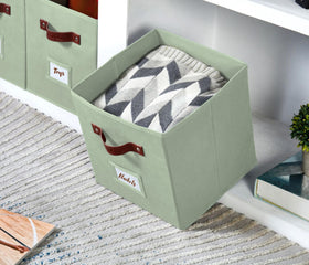 DECOMOMO sage green storage bin stacked neatly in a cube shelf