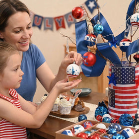 Decor by Hannah patriotic ball with matte finish offers a subtle, modern patriotic touch.