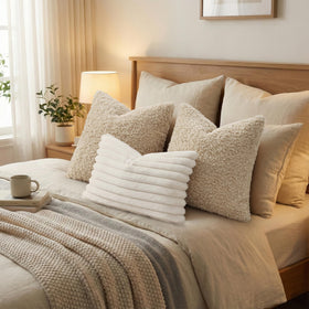 decorUhome natural-tone oatmeal pillow cover complements plant-inspired decor.