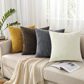 decorUhome Living room decor setup with neutral cream cushions on a sofa