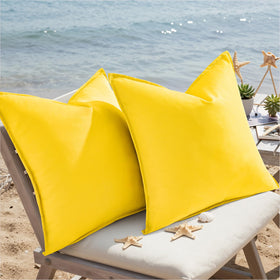 decorUhome sofa shot with yellow pillow covers for cozy living spaces