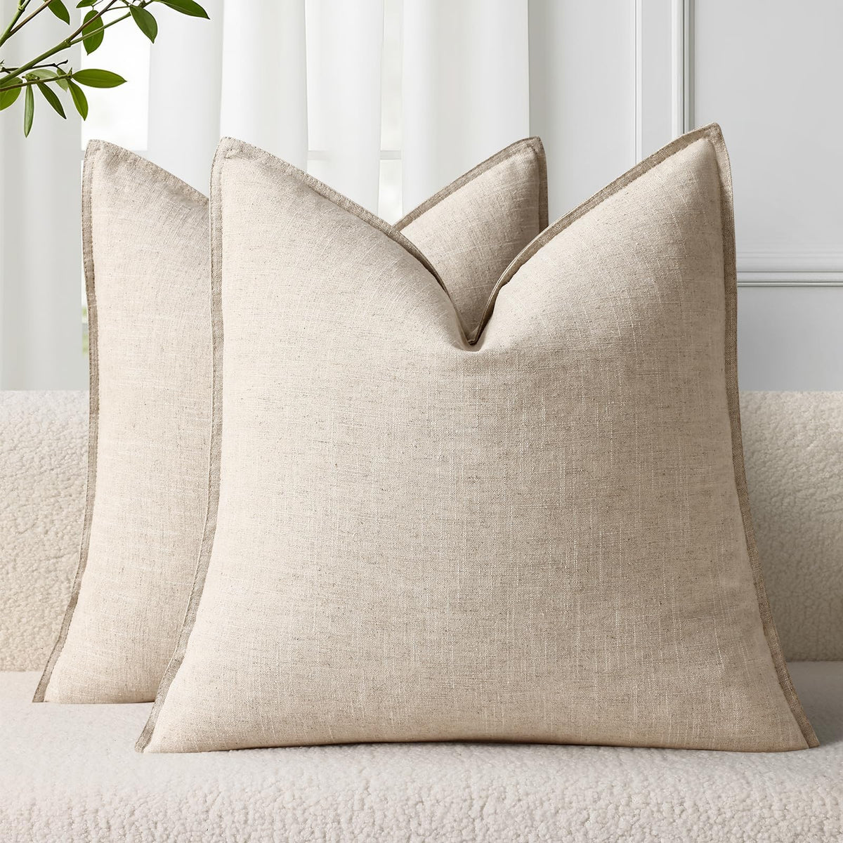decorUhome Summer Linen Euro Sham with flange edge adds cozy farmhouse style to a sofa.
