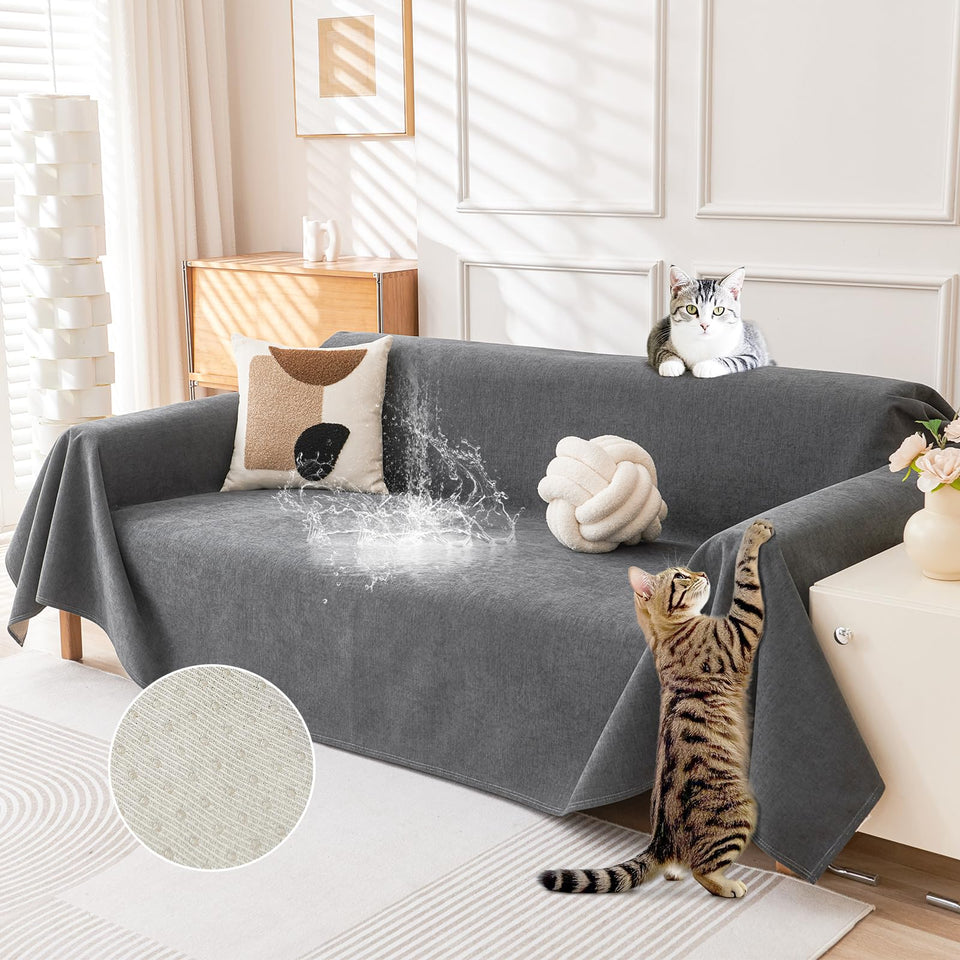 Deep Dream cat-scratch resistant couch cover on a dark grey sofa protects upholstery.
