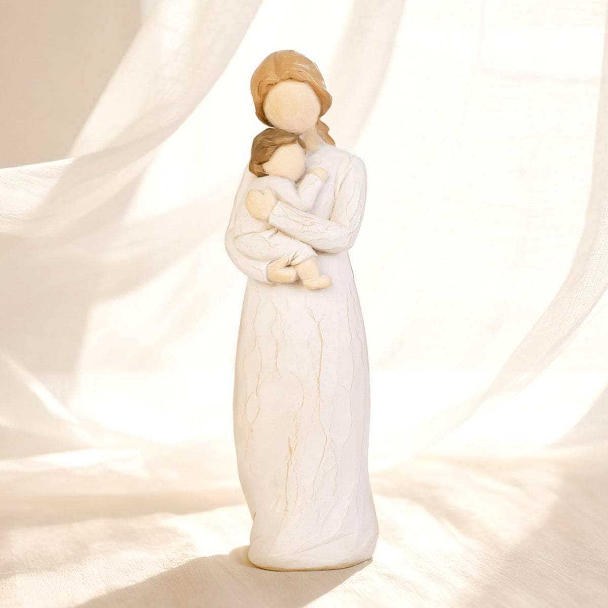 Dekismeos standing new mom gift figurine for elegant display on shelves.
