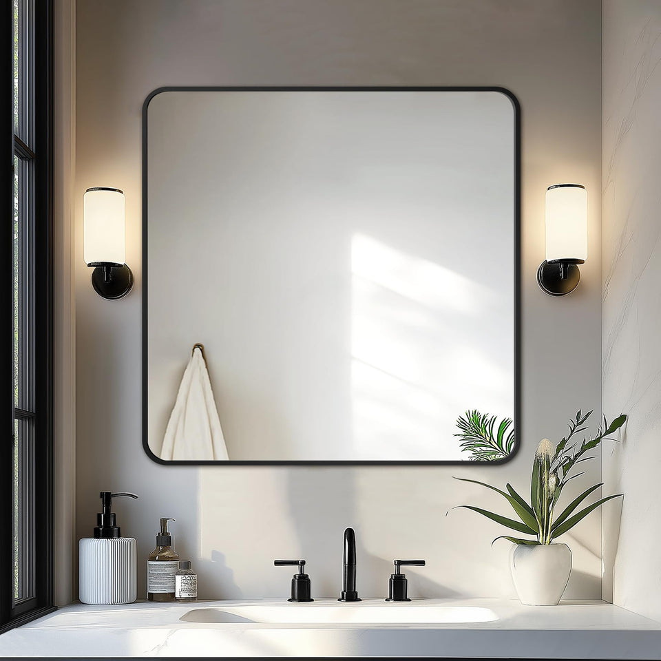 Delma bathroom mirror with black frame over sink for a crisp, clear reflection.