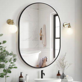 Delma oval 36x24 mirror with black frame ideal for wall mounting and brighter spaces.