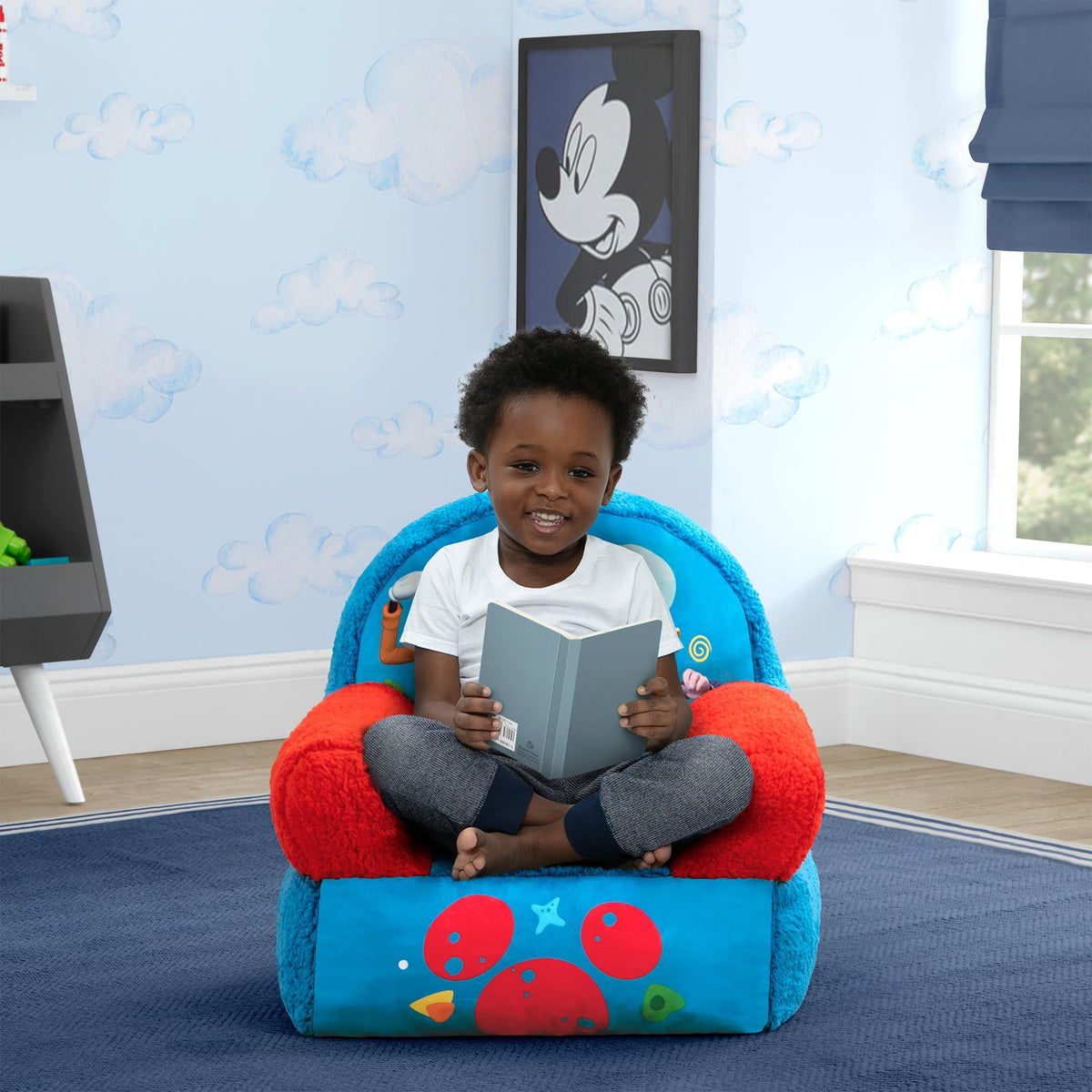 Delta Children Cozee Buddy Chair plush fabric close-up shows soft texture.