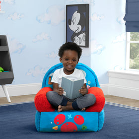 Delta Children Cozee Buddy Chair plush fabric close-up shows soft texture.