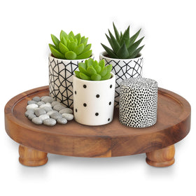 Demigo 10in acacia round tray pedestal for elegant tabletop display and organization.