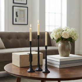 Denique iron taper candle holder arrangement shown on mantel with decor