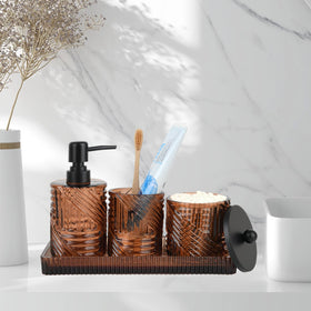 Deobath amber glass toothbrush holder keeps brushes organized on the counter.