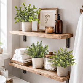 Der Rose desk decor setup with eucalyptus topiaries in sage green.