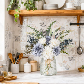 Der Rose navy blue dahlia arrangement in clear vase for centerpieces.
