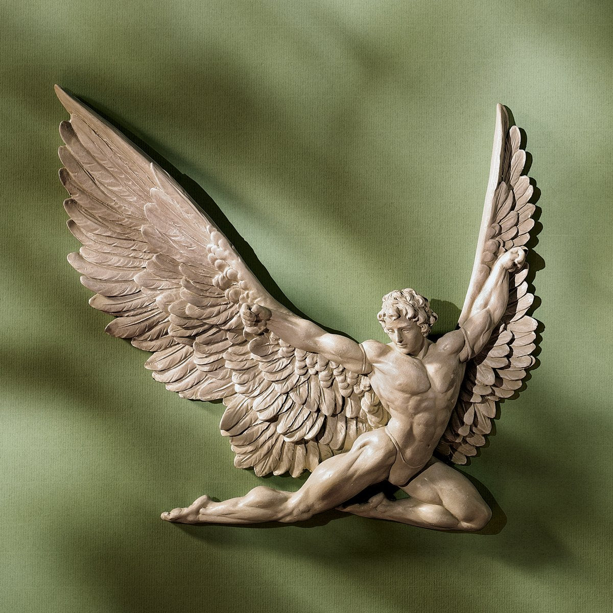 Design Toscano Icarus wall sculpture in ivory finish for timeless classical décor accents.