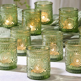 DEVI green votive holders create romantic wedding centerpiece glow.