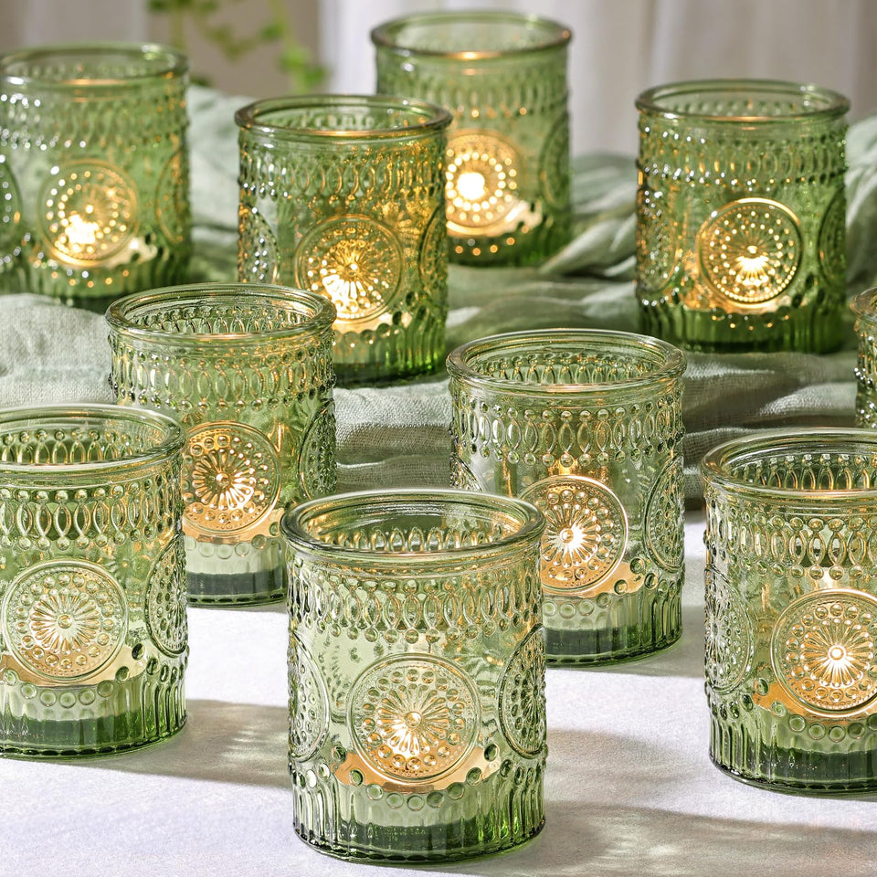 DEVI green votive holders create romantic wedding centerpiece glow.