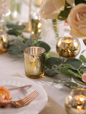 DEVI round mercury glass votives showcase elegant light for intimate dinners.