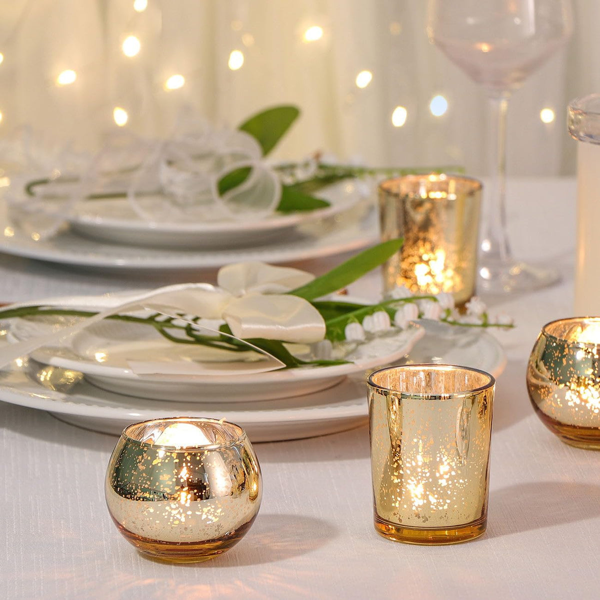 DEVI two shapes gold votive holders for mixed wedding centerpieces.