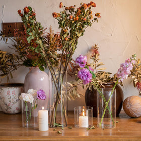 Devilfire glass cylinder vase on a dining table for modern decoration