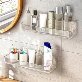 Diesisa acrylic wall-mount shelf in bathroom keeps toiletries organized.