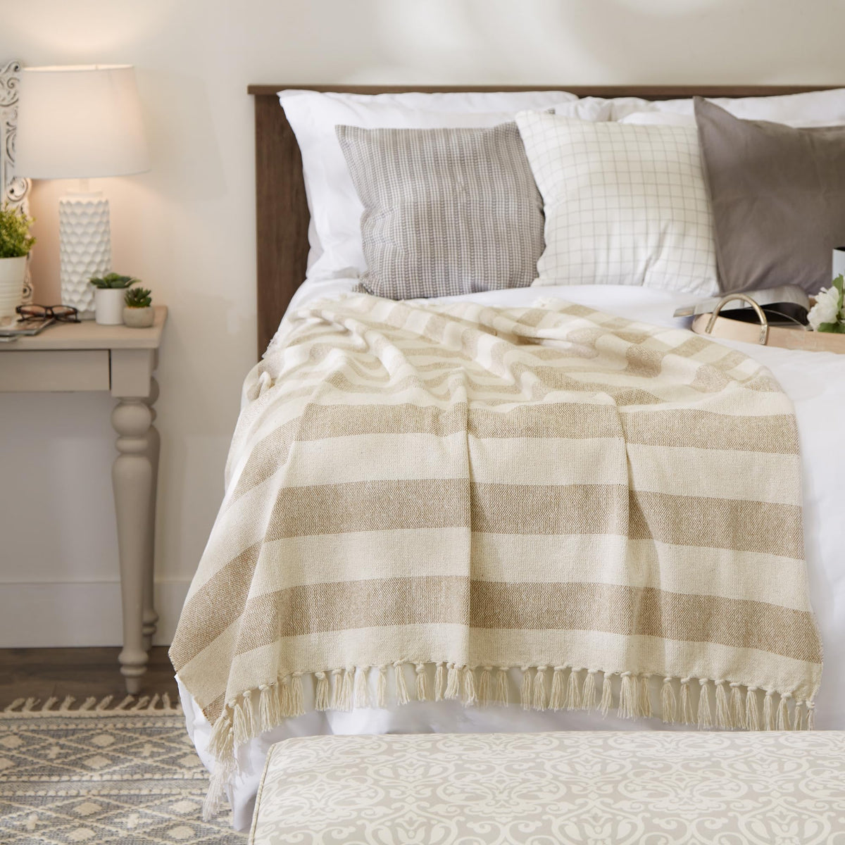 DII cabana striped blanket on bed-side table for quick warmth