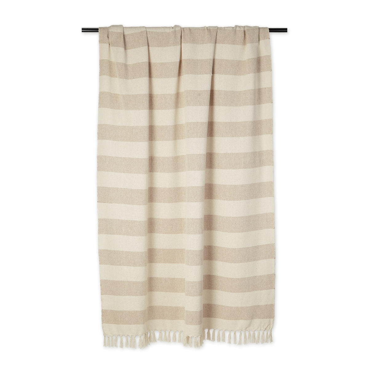 DII cabana striped blanket on sofa adds warm color and texture