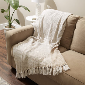 DII woven throw on a sofa enhances rustic to modern decor with warmth