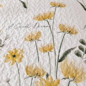 Dinjoy bed with queen quilt spread draped neatly over the edge