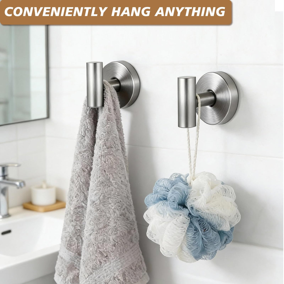 Disbam suction cup hooks on a glass mirror organize towels and accessories.