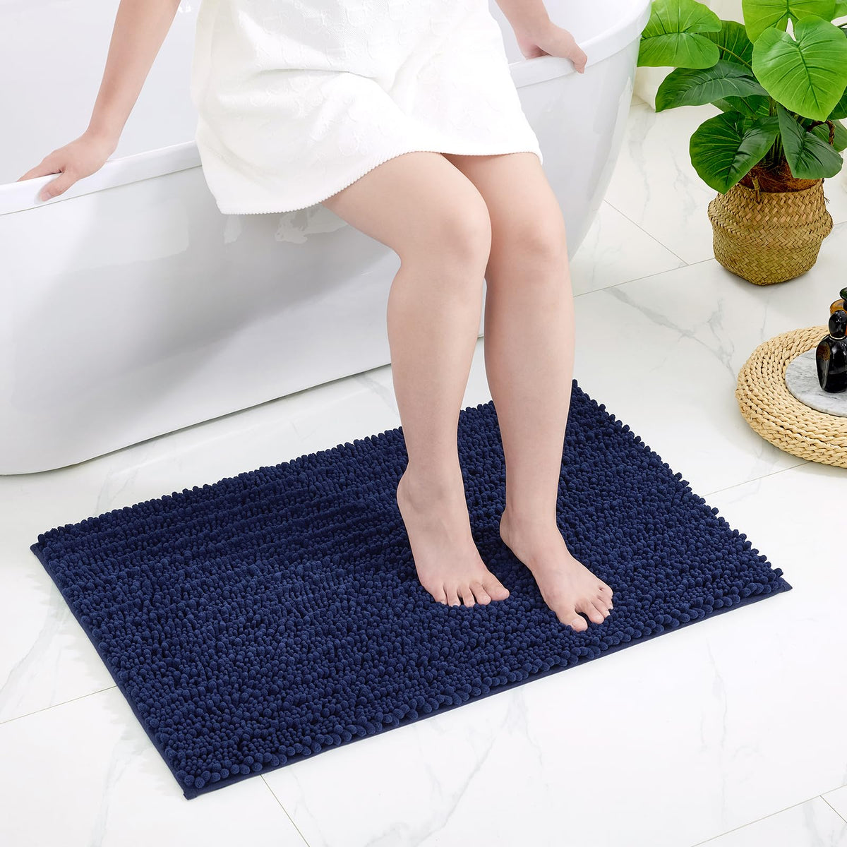 Disolla rug paired with towels enhances coordinated bathroom decor.