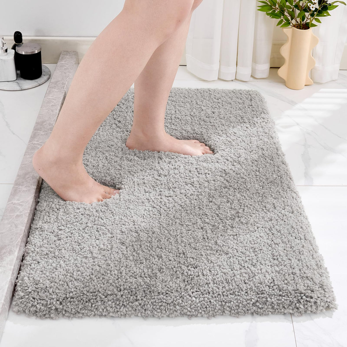 Disolla Grey bathroom rug 20x32 with plush pile for comfort.
