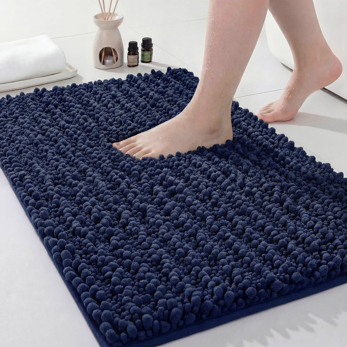Disolla Navy Blue Bathroom Rug 20x32 in showcases plush chenille design for soft footfall.