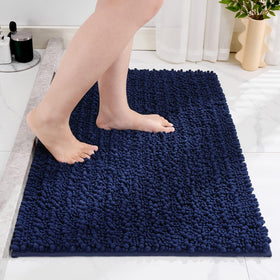 Disolla navy blue rug placed in front of vanity creates a cozy, absorbent area.