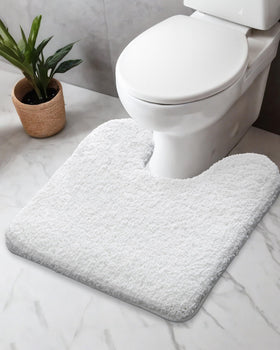 Disolla u-shaped white toilet rug with non-slip foam latex backing for secure placement.