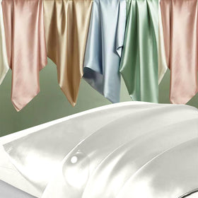 DKBslik silk pillowcase texture close-up shows smooth, cool feel for sleeping comfort.