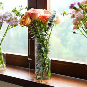 DNANAOL 8-inch cylinder vase with floating candles for a modern look.
