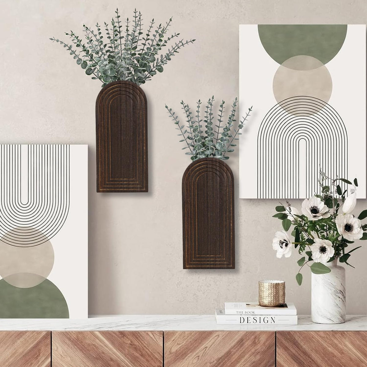 Dnnnii wall vase display with greenery creates a fresh wall vignette.