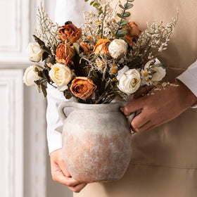 Dobbyby rustic terracotta finish vase adds natural charm to any room.