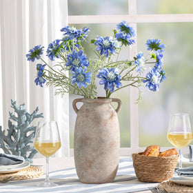 Dobbyby terracotta vase doubles as a kitchen utensil holder and decorative accent.