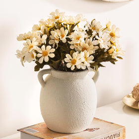 Dobbyby vase on bookshelf provides a subtle accent.