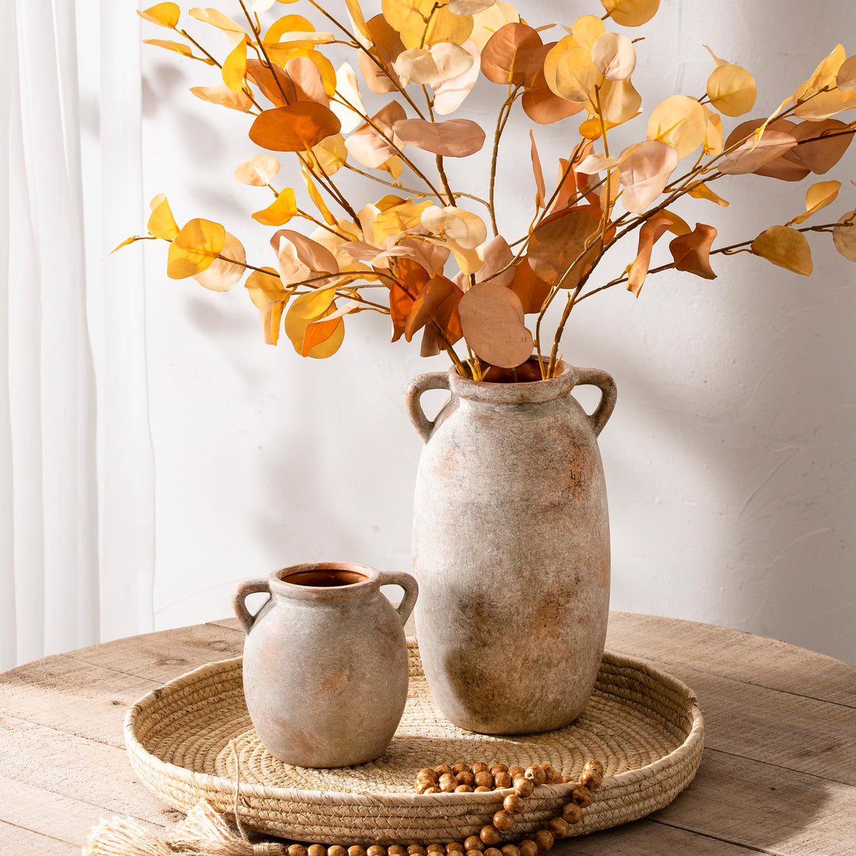 Dobbyby vase on mantle with fresh flowers creates living room charm