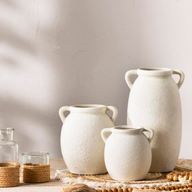 Dobbyby ceramic vase on mantel, blends boho and farmhouse aesthetics.