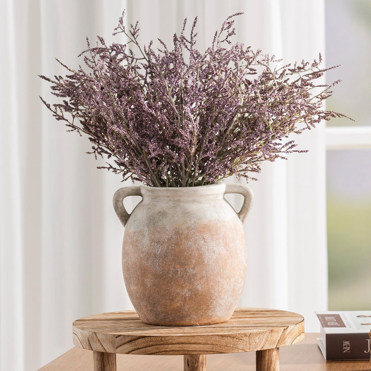 Dobbyby vase interior is waterproof for fresh or dried arrangements.