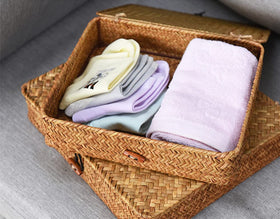 DOKOT seagrass bins on kitchen vanity help cosmetics stay organized.