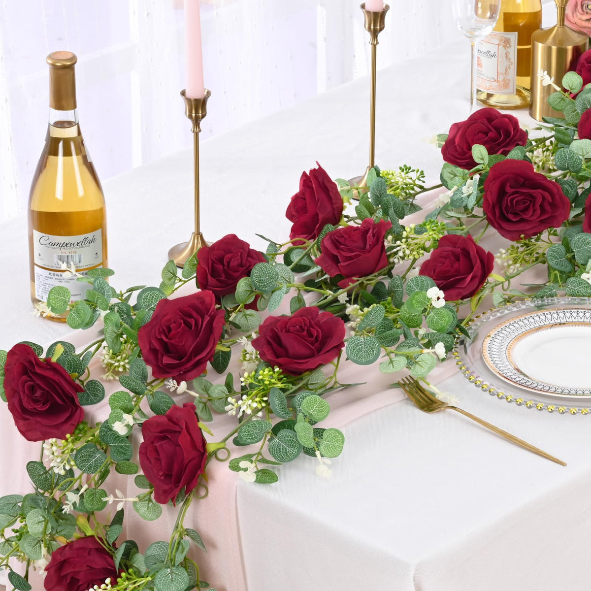 Dolicer eucalyptus garland close-up shows 8 red roses and realistic greenery.
