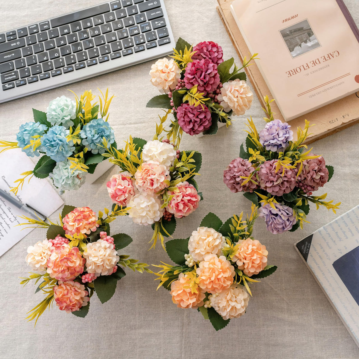 Donmills hydrangea arrangement on an office desk adds color and life.