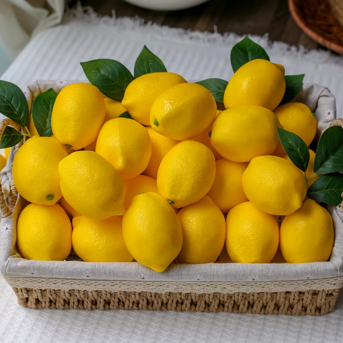 Donotgo centerpieces with lemons and leaves elevate dining table decor.