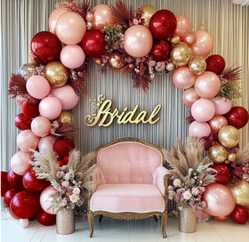 Ruby red pink pearl balloons add luxurious color to celebrations.